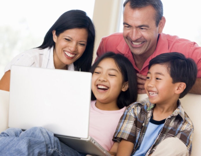 family watching movie on laptop